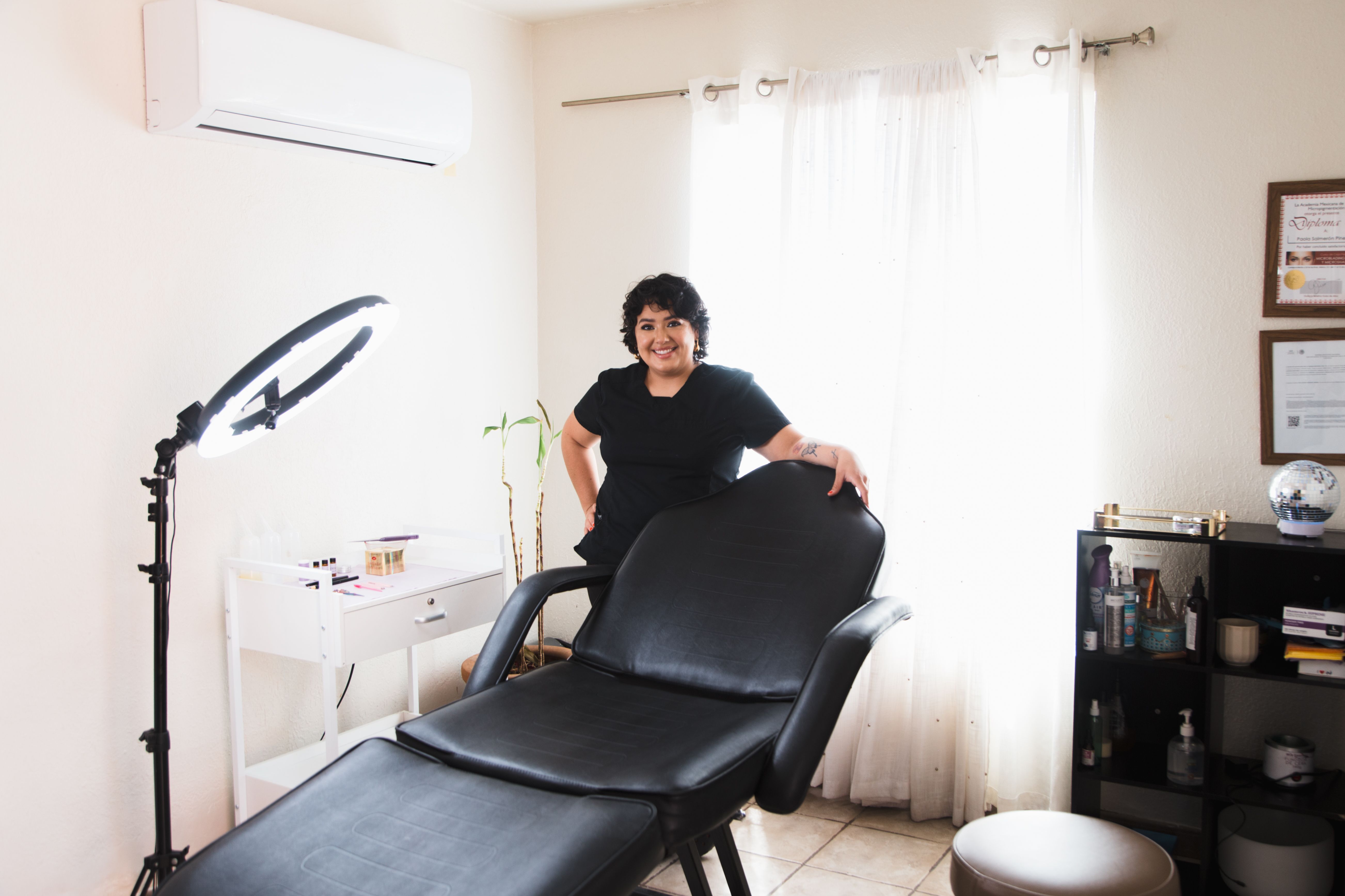 professional female brow artist working in modern beauty salon, lifestyle photography